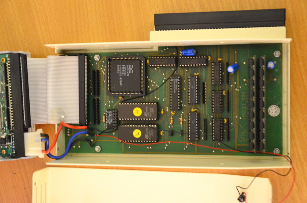 The Multi-Evolution shown from the top with the hard drive moved out of the way. Various integrated circuits can be seen on the main board.