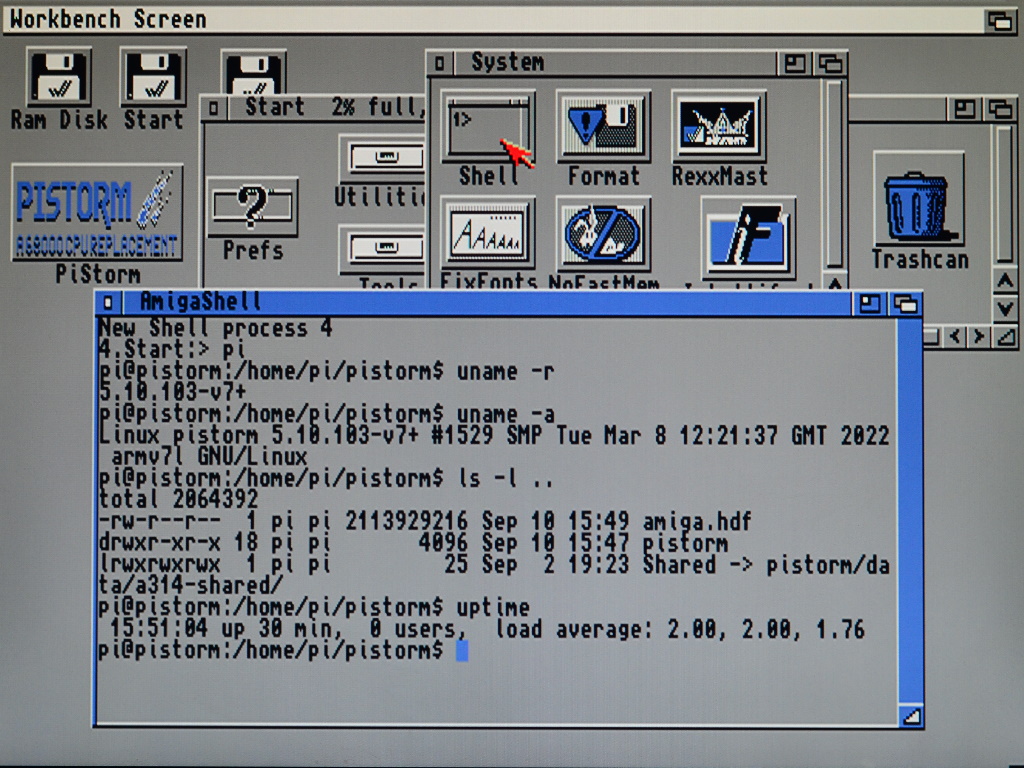 Screenshot showing the Amiga Workbench with a shell window open. In the shell window the "pi" command is used to open a Linux shell on the Raspberry Pi.