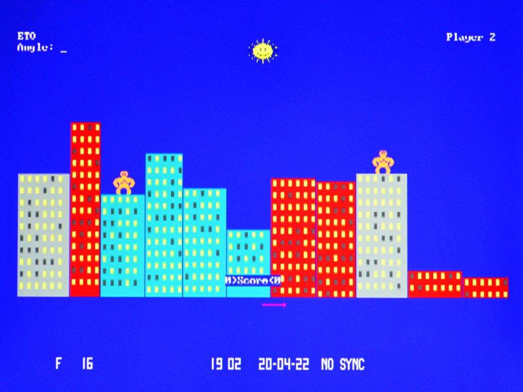 Screenshot of the GORILLA.BAS example program runnin. It shows a two dimensional city scape with two apes on top of the buildings.
