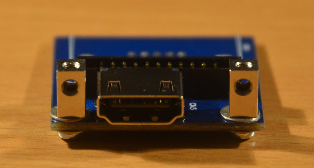 The video board with the VGA connector removed and two stand-offs next to the HDMI connector